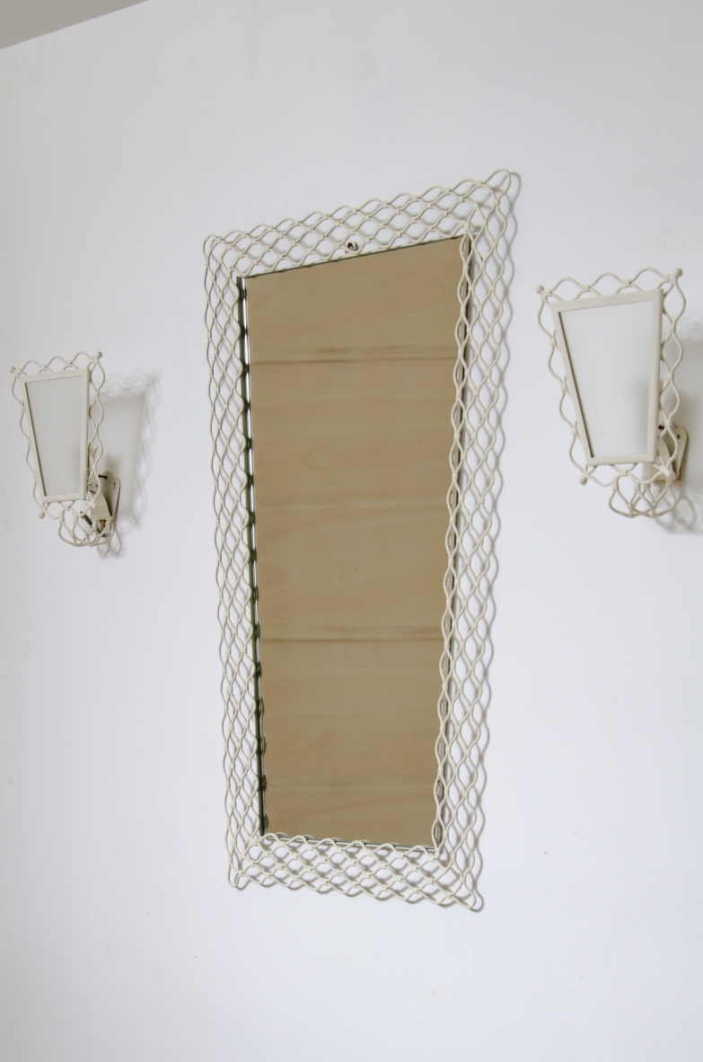 Mirror with curved metal mesh frame with two wall lights of the same workmanship with satin glass.  Italy 1950s.