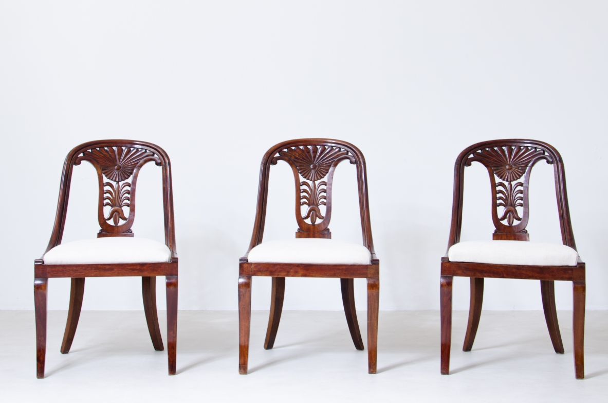 Rare set of 12 walnut cockpit chairs in walnut with carved back.  Charles X period,  Northern Italy, around 1830s.