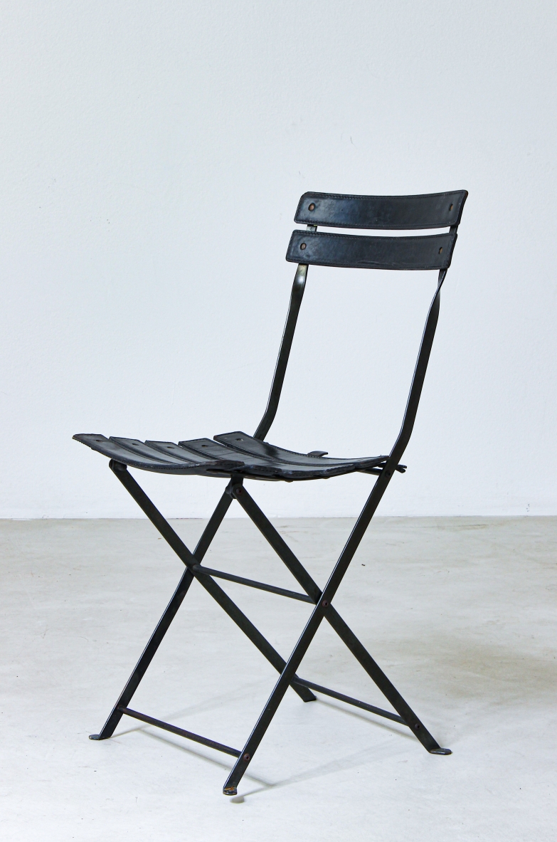 Folding chair in iron with upholstered in black leather. Italian manufacture, 1970's.