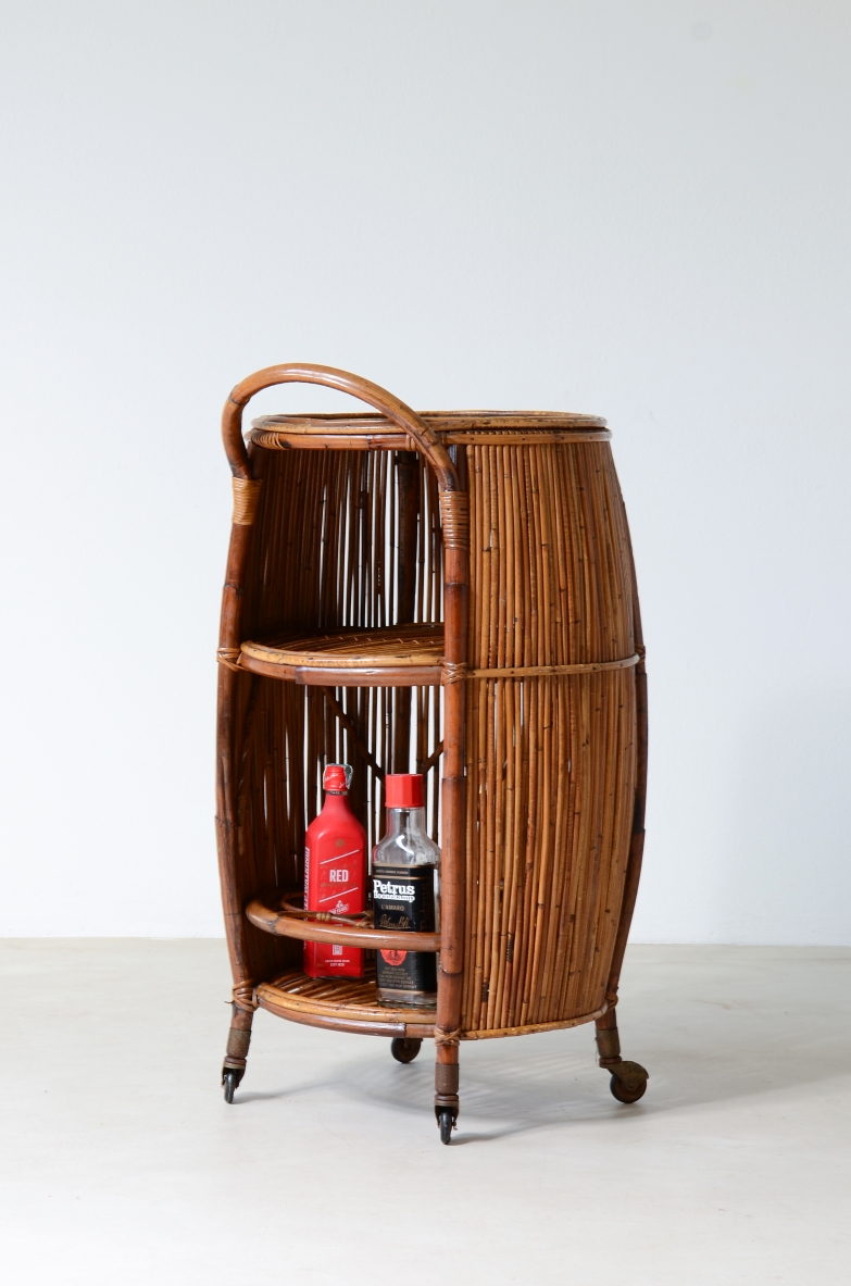 Bar cabinet in rattan and woven staraw, wooden top and compartments for bottles and glasses.  Italian manufacture, around 1950.