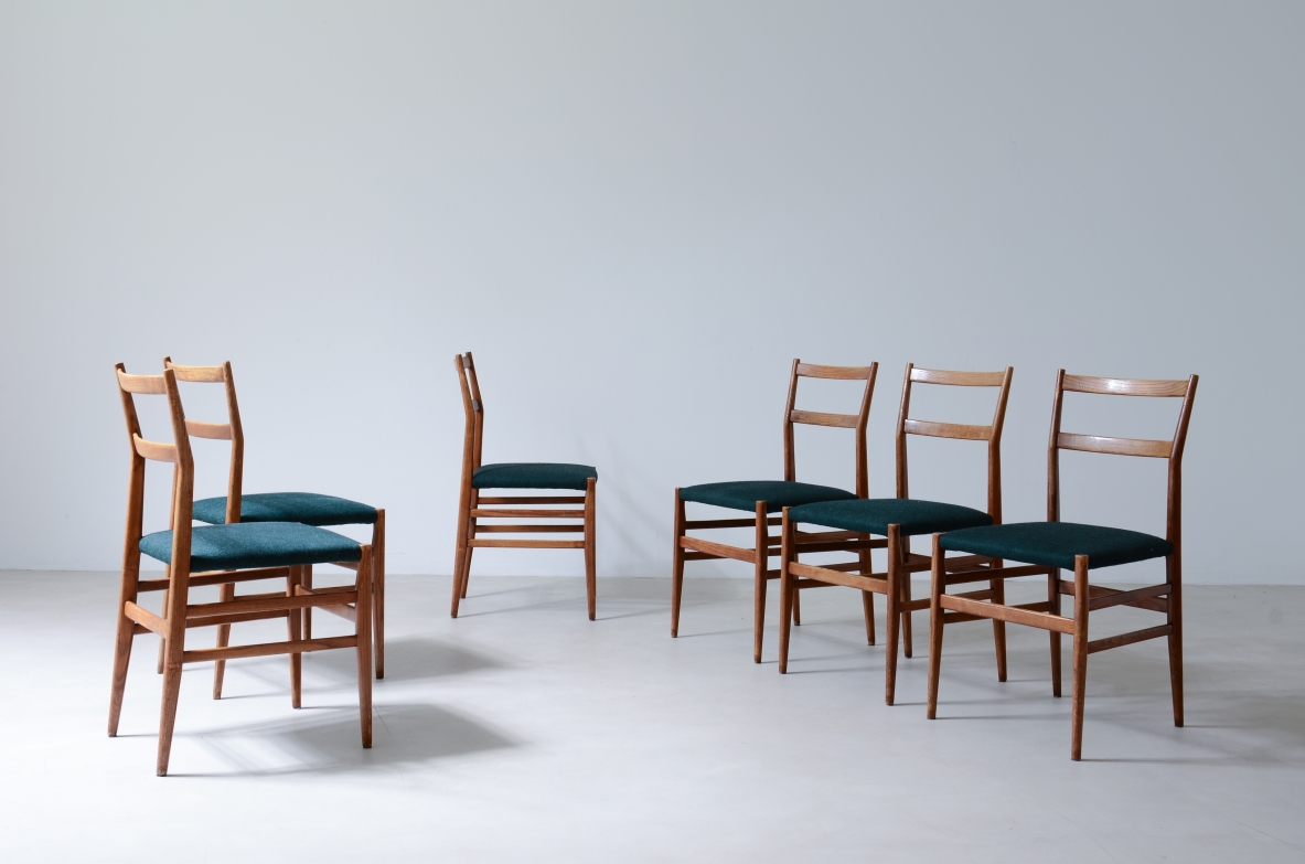Gio Ponti  Set of 6 chairs in nut wood with fabric covering.  Model leggera