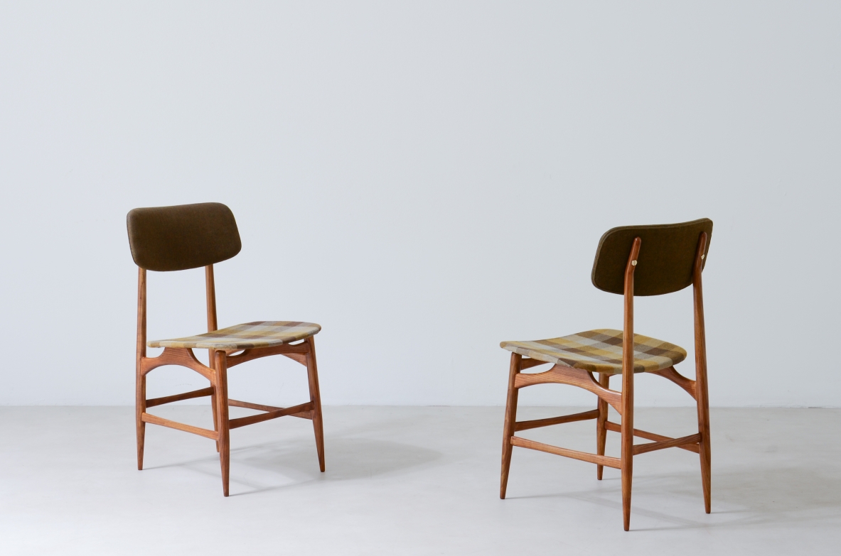 Two chairs with wooden structure and seat and back in padded fabric.  Italian manufacture late 1950s.