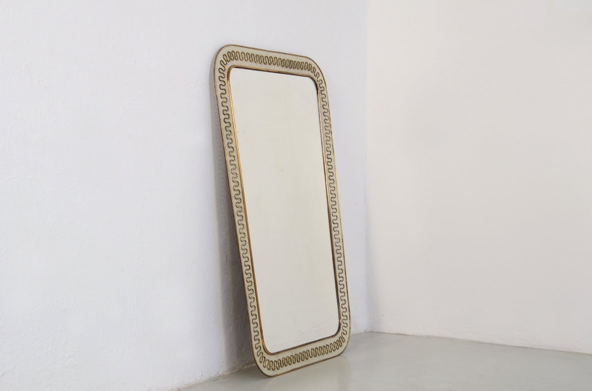Elegant Italian 1950's mirror with metal and brass frame.