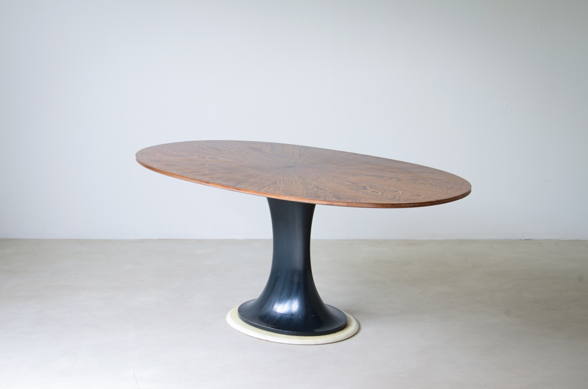 Elegant oval table with turned base in petrol blue lacquered wood and marble disc.  Palm wood veneer top.  Turin School, 1960's.