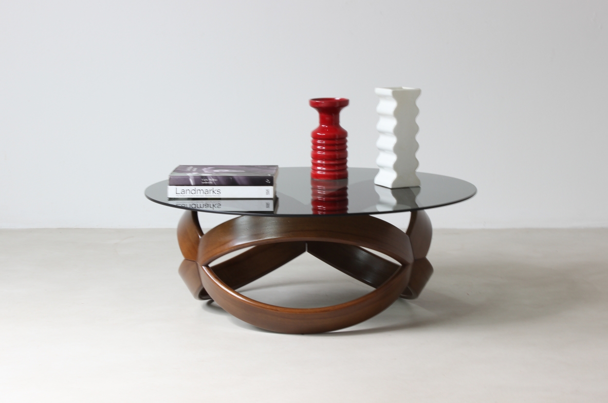 Low table with curved wooden base. Italian manufacture, 1970's.