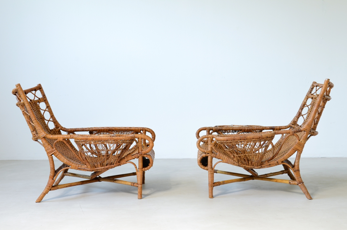 Pair of elegant willow armchairs with weaving on the seat and back as well as composed details, shapes and decorations. Italian manufacture 1950ca.