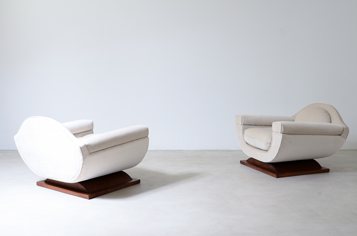 Pair of large organically shaped armchairs with wooden base, covered in cotton velvet.  Italian manufacture from the 1960s