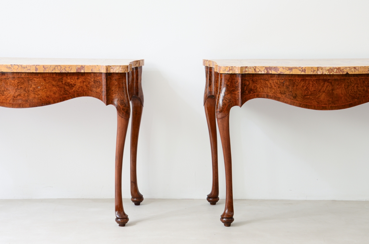 Pair of important consoles in walnut burl with wavy band and turned legs. Top veneered in ancient yellow marble of Roman origin.  Manufacture around 1750