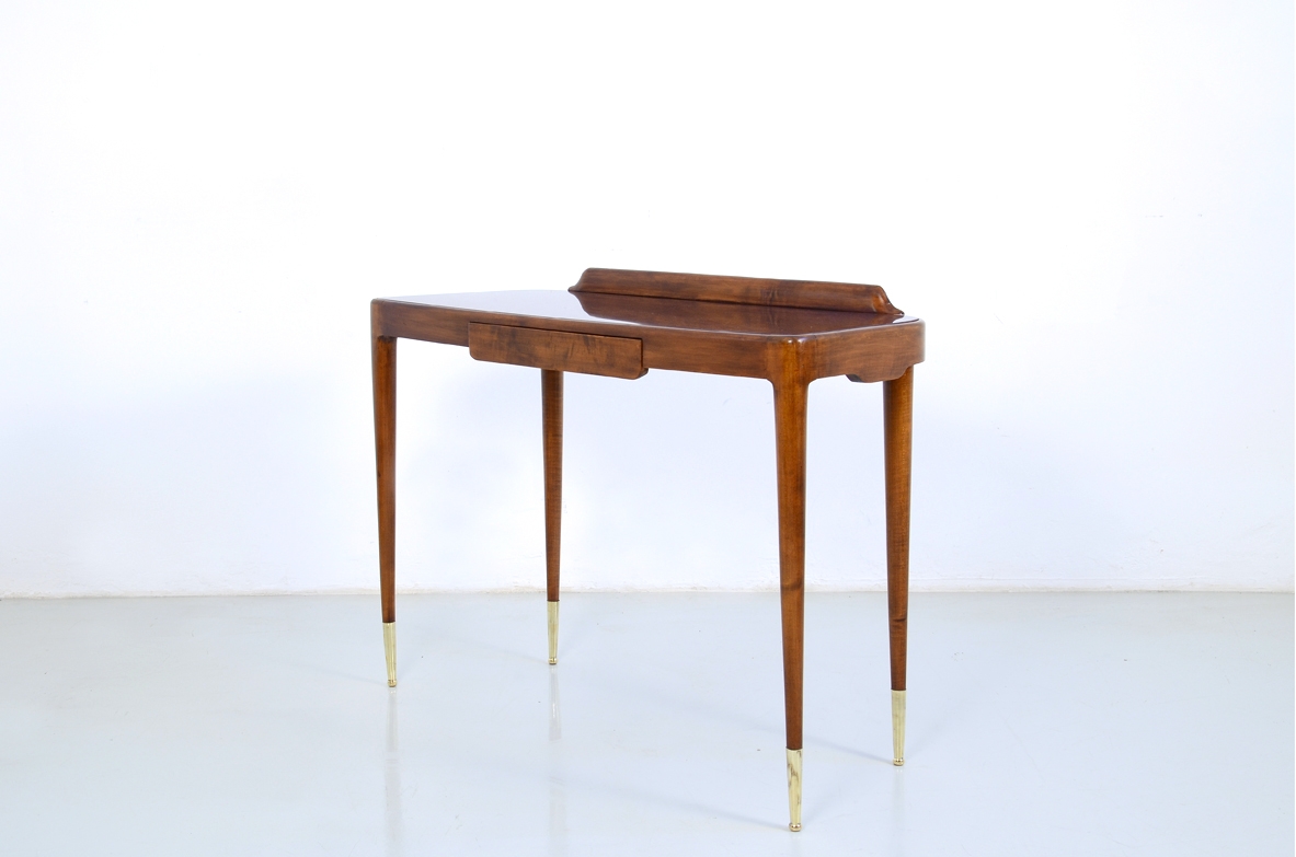 Elegant Italian 1950's console table with thin legs on long bronze tips.
