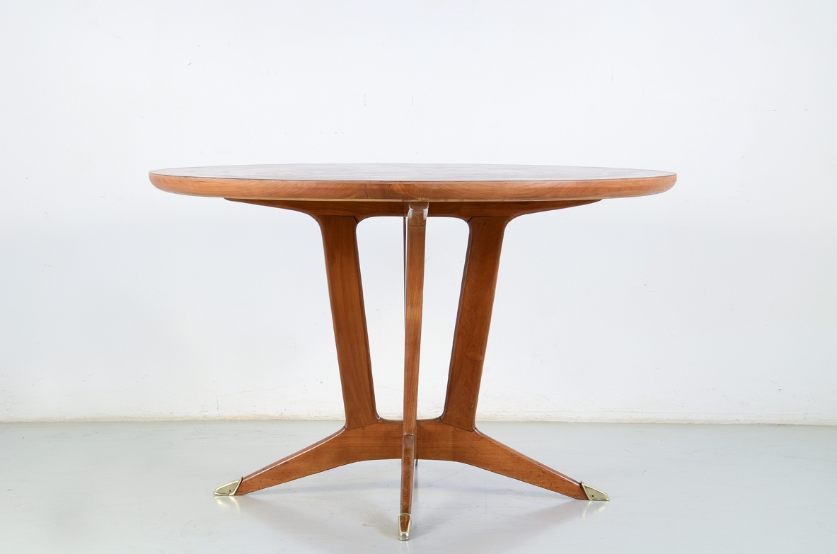 Elegant Italian 1950's table in cherry wood with bronze tips.