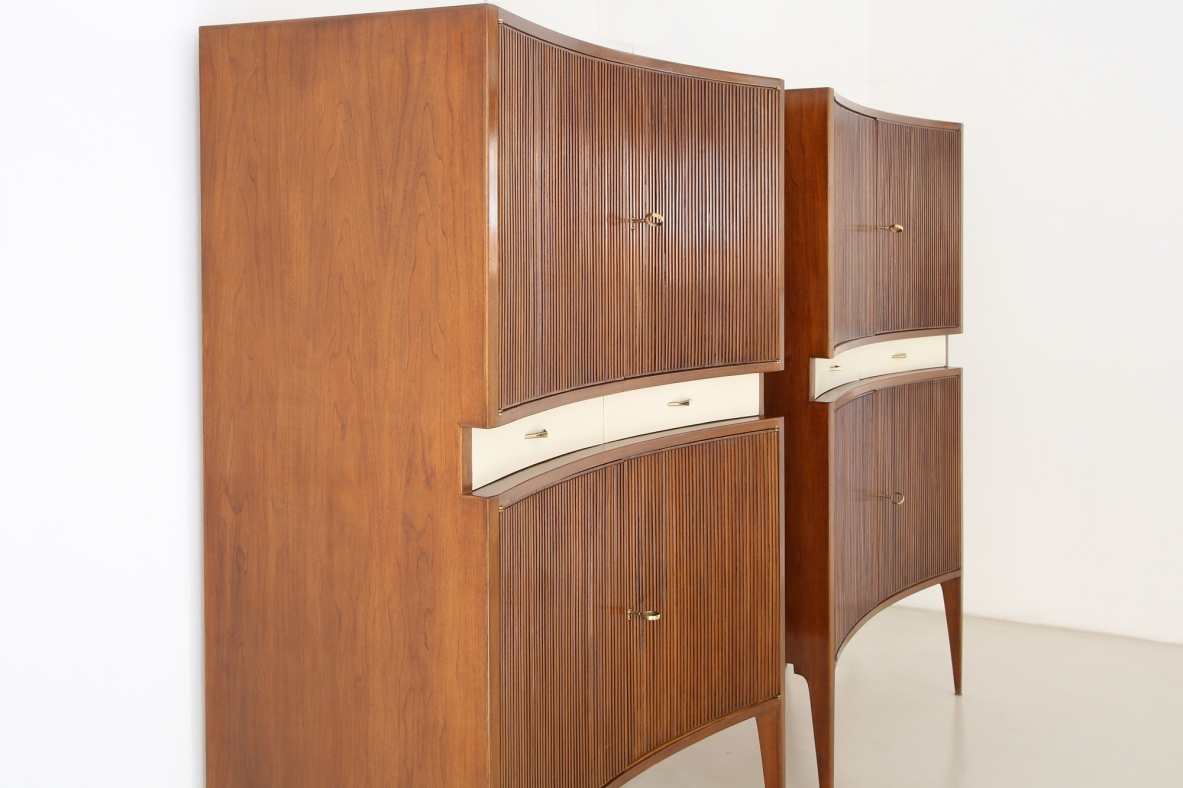 Pair of 1950's unique highboards with grinded concave front and very thin long elegant legs, attr. to Guglielmo Ulrich.