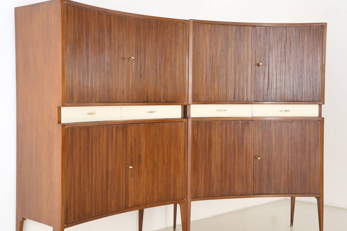 Pair of 1950's unique highboards with grinded concave front and very thin long elegant legs, attr. to Guglielmo Ulrich.
