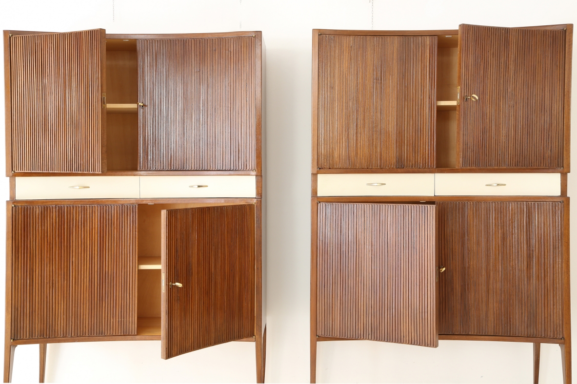 Pair of 1950's unique highboards with grinded concave front and very thin long elegant legs, attr. to Guglielmo Ulrich.