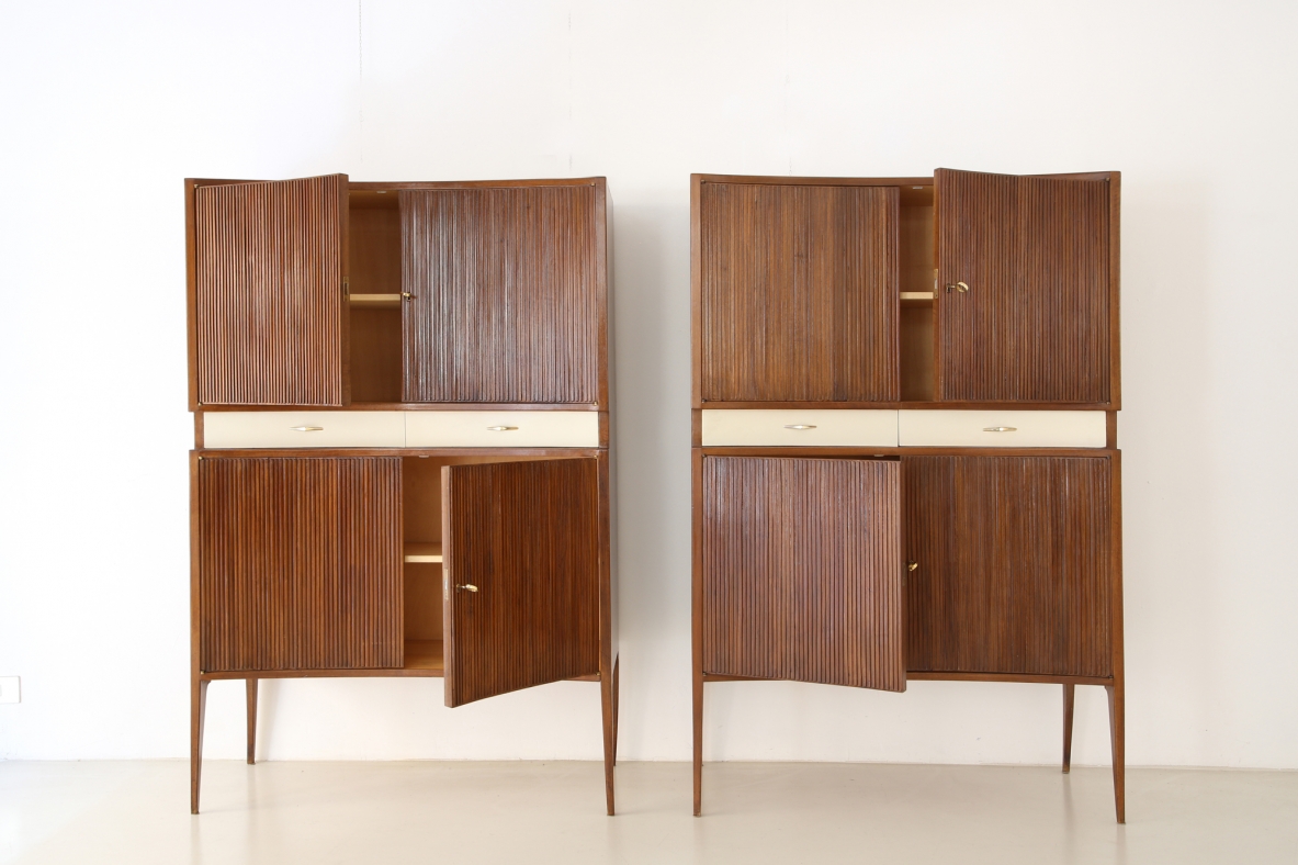 Pair of 1950's unique highboards with grinded concave front and very thin long elegant legs, attr. to Guglielmo Ulrich.