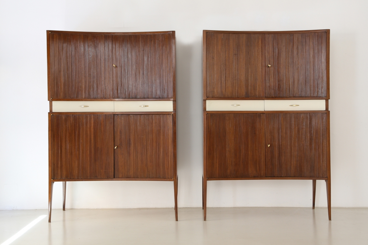 Pair of 1950's unique highboards with grinded concave front and very thin long elegant legs, attr. to Guglielmo Ulrich.