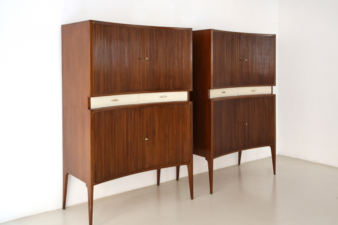 Pair of 1950's unique highboards with grinded concave front and very thin long elegant legs, attr. to Guglielmo Ulrich.