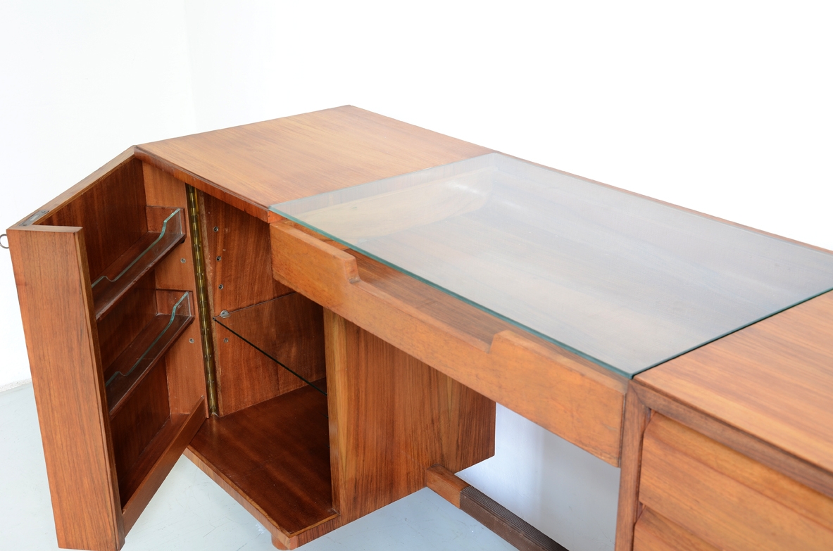 Italian 1950's sideboard in light walnut with five drawers, a nice desk and a bar cabinet.