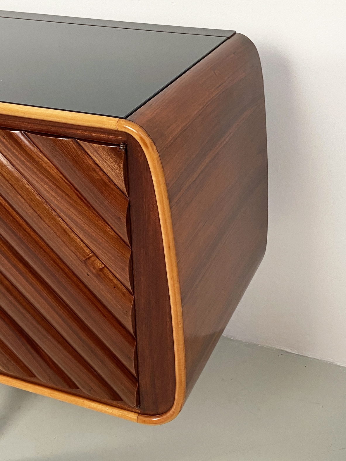 Splendid Italian 1950's sideboard with a very refined wooden front and four thin legs with brass tips.