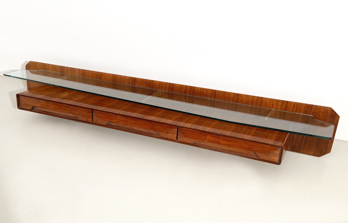 Italian 1960's console table in rosewood with a very nice shaped thick crystal glass and brass details.