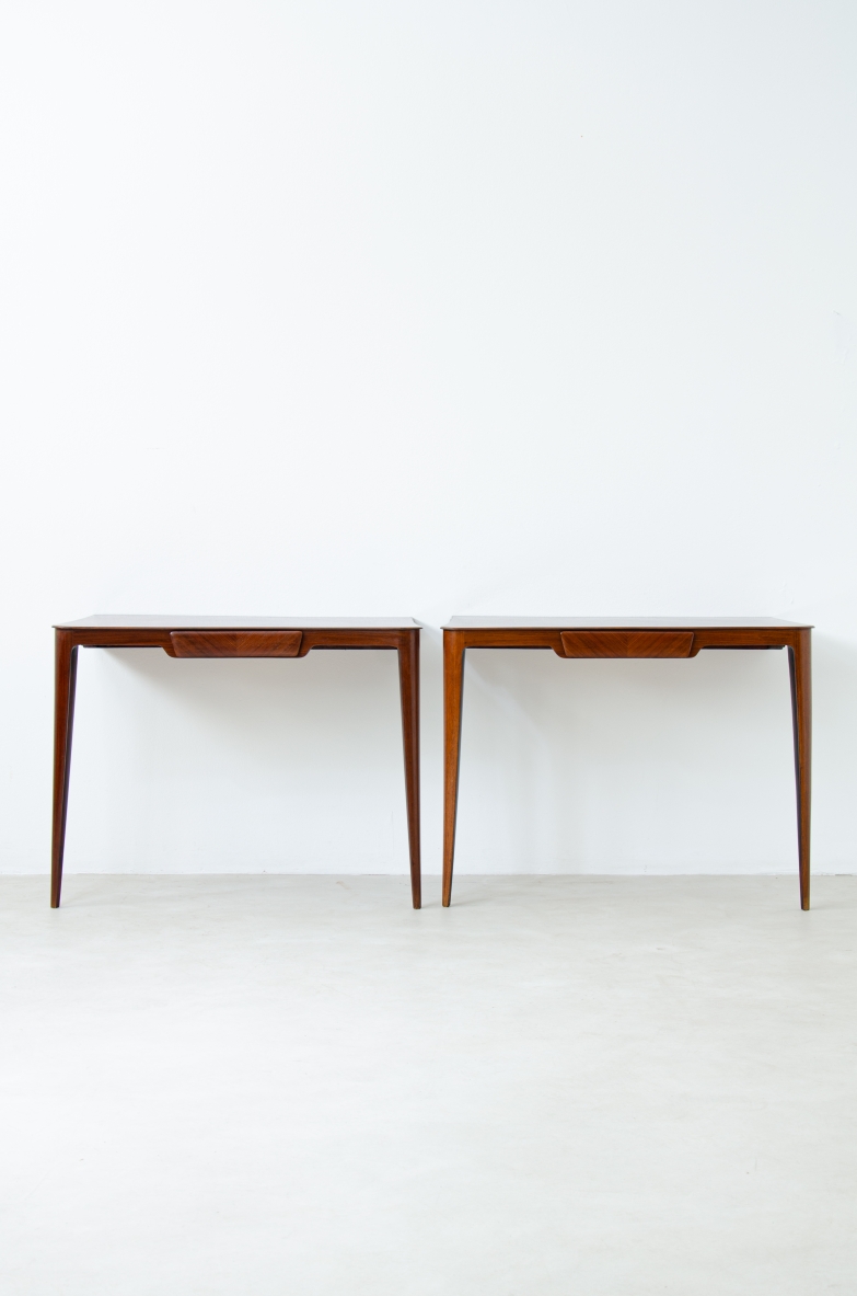 Elegant pair of wooden consoles with exotic wood veneer top and shaped drawer on the front.  Attr. Carlo Rava, 1950s.