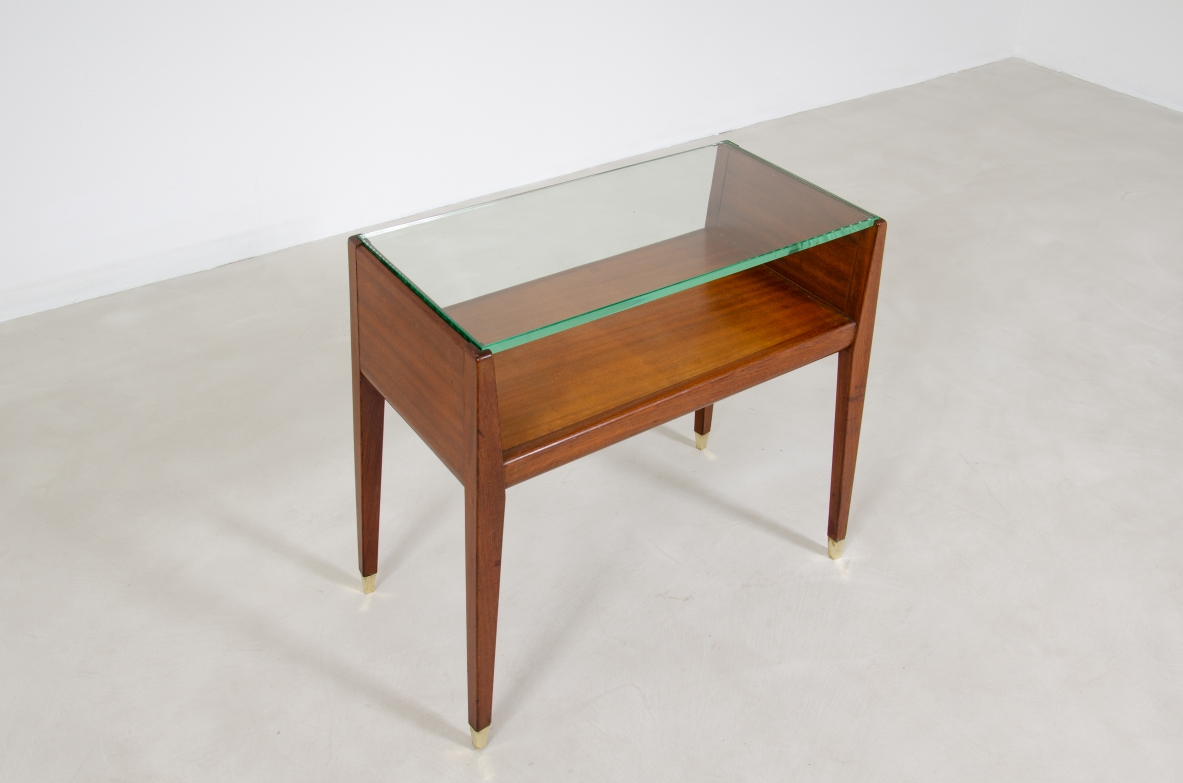 Pair of wooden bedside tables with glass top and brass tips. Italian manufacture, 1950's.