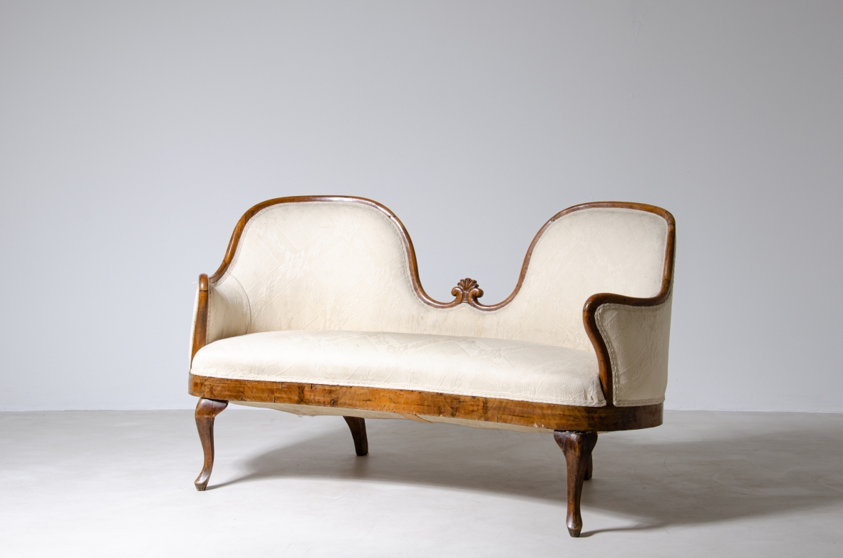 Elegant two-seater sofa in wood and fabric.  Italy, epoque Charles X, around 1830.