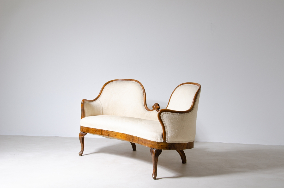 Elegant two-seater sofa in wood and fabric.  Italy, epoque Charles X, around 1830.
