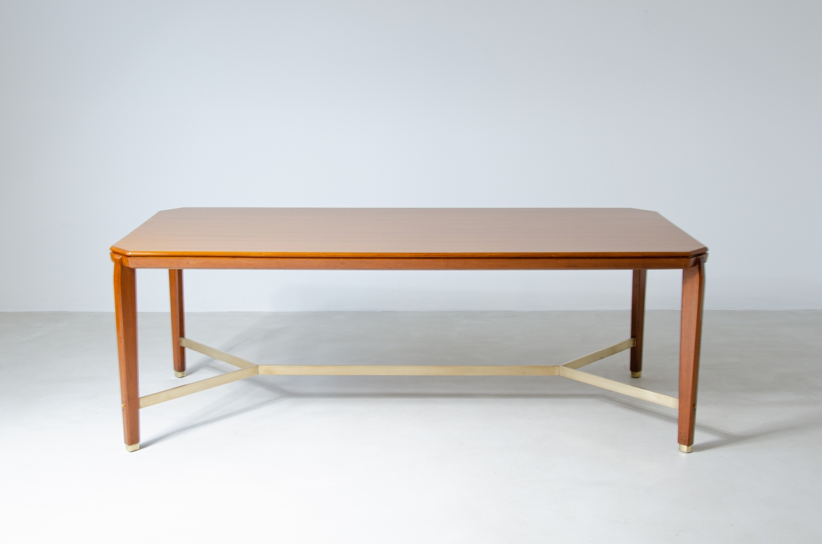 Gio Ponti (1891-1979)  Table in blond walnut with brass cross.  Designed and produced for the BNL offices in Milan in 1956.