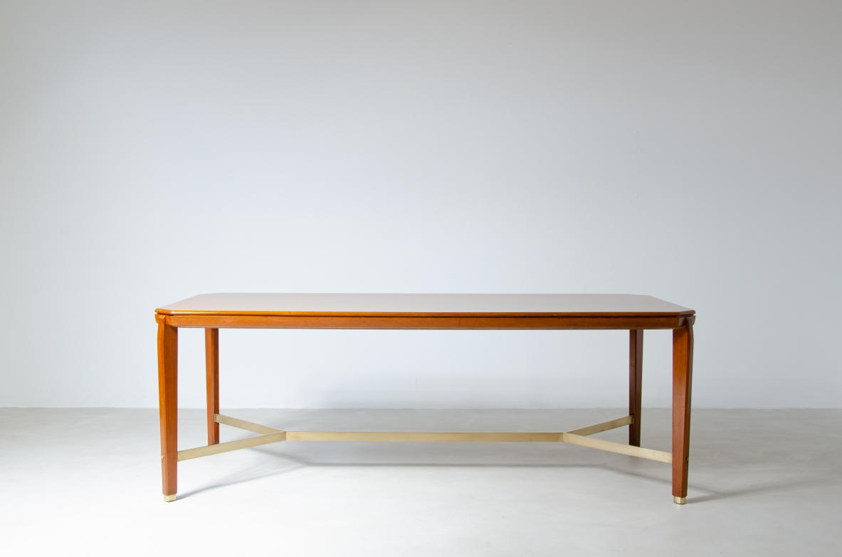 Gio Ponti (1891-1979)  Table in blond walnut with brass cross.  Designed and produced for the BNL offices in Milan in 1956.