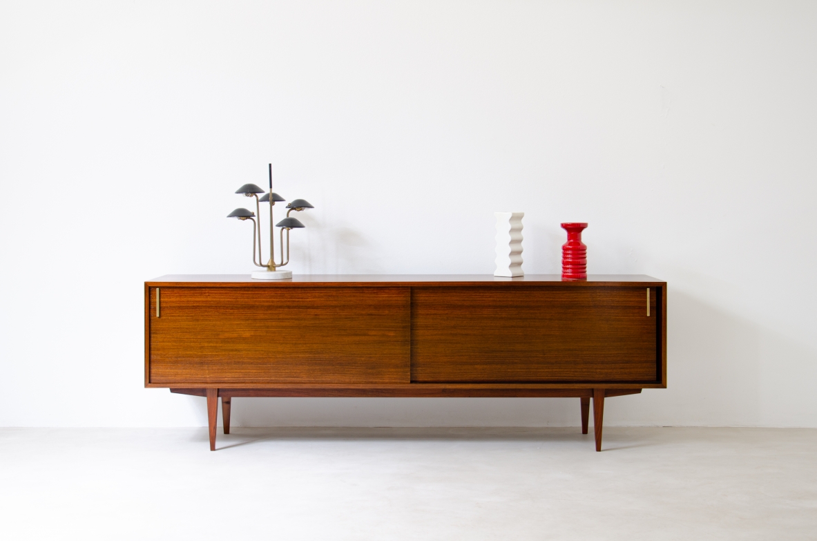 Modernist sideboard in teak with two sliding doors.  Italian manufacture, 1960s.