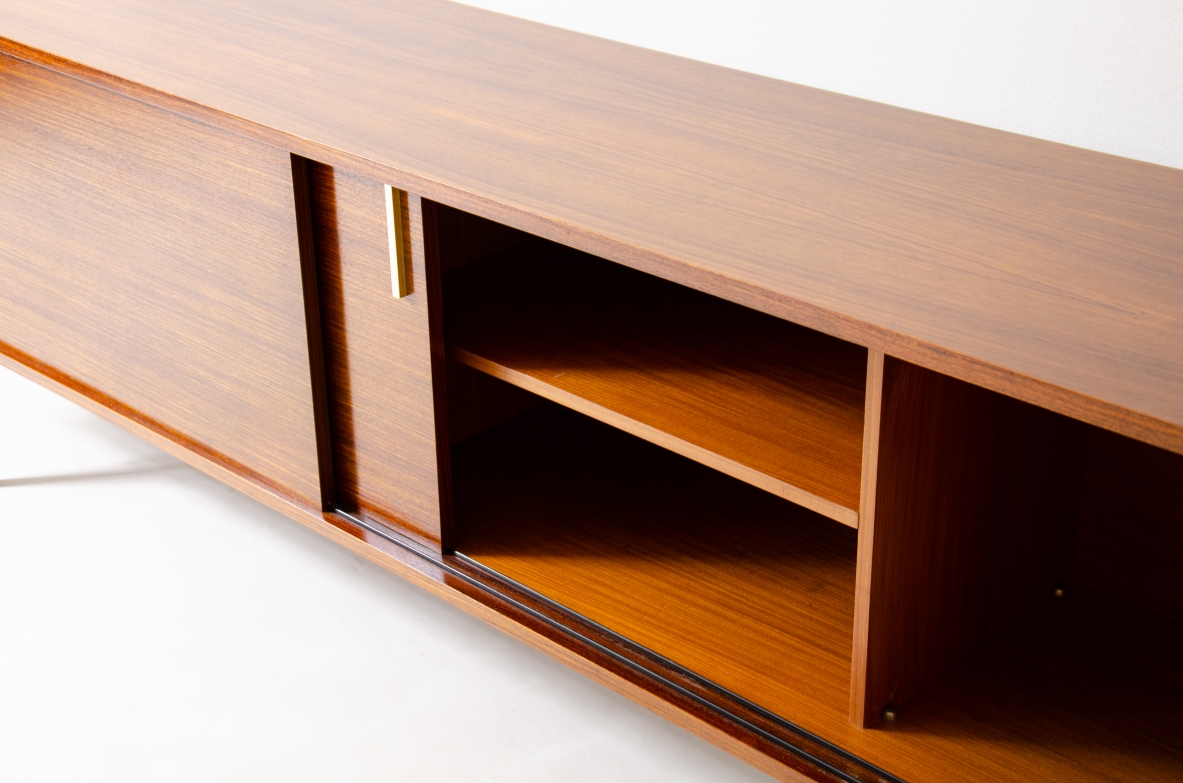 Modernist sideboard in teak with two sliding doors.  Italian manufacture, 1960s.