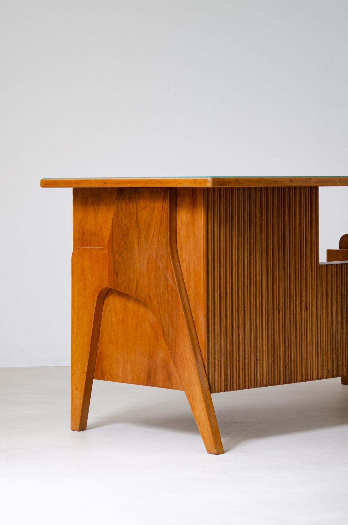 Oak desk with ribbed wood structure and green opaline glass top. Turin school, Italy, 1950's