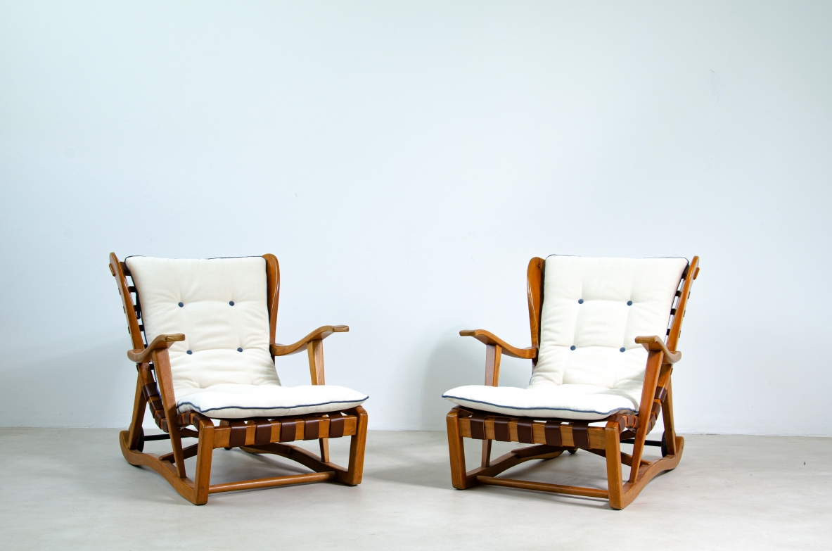 Guglielmo Pecorini. Rare pair of armchairs with rear wheels, coming from the Giulio Cesare ocean liner.