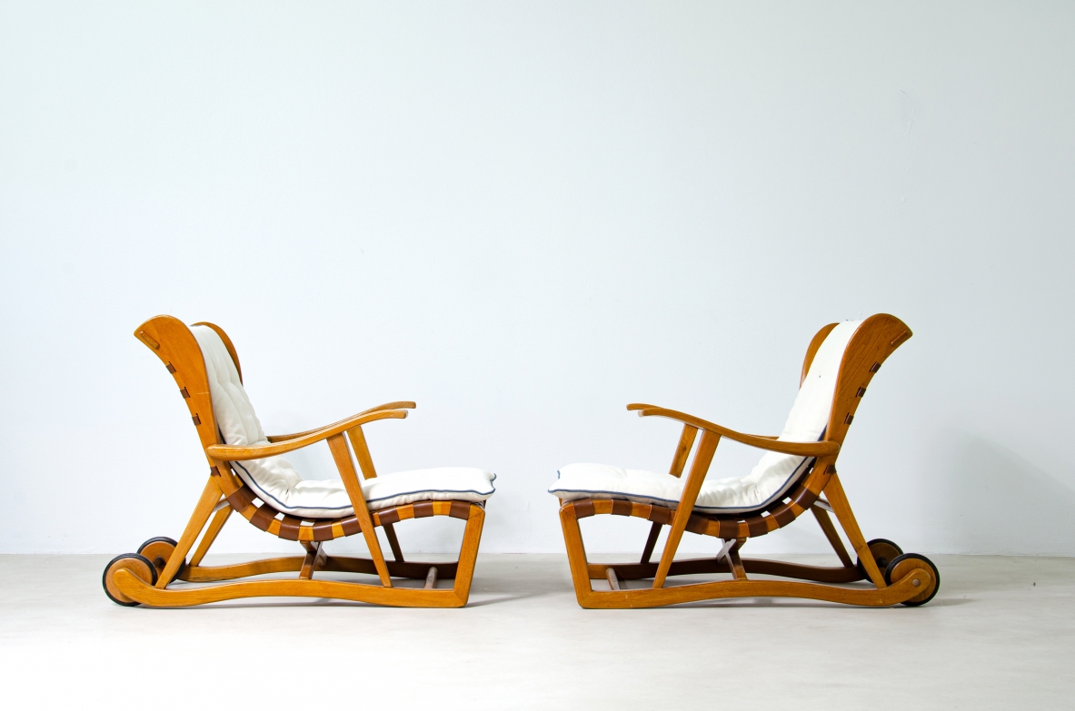 Guglielmo Pecorini. Rare pair of armchairs with rear wheels, coming from the Giulio Cesare ocean liner.