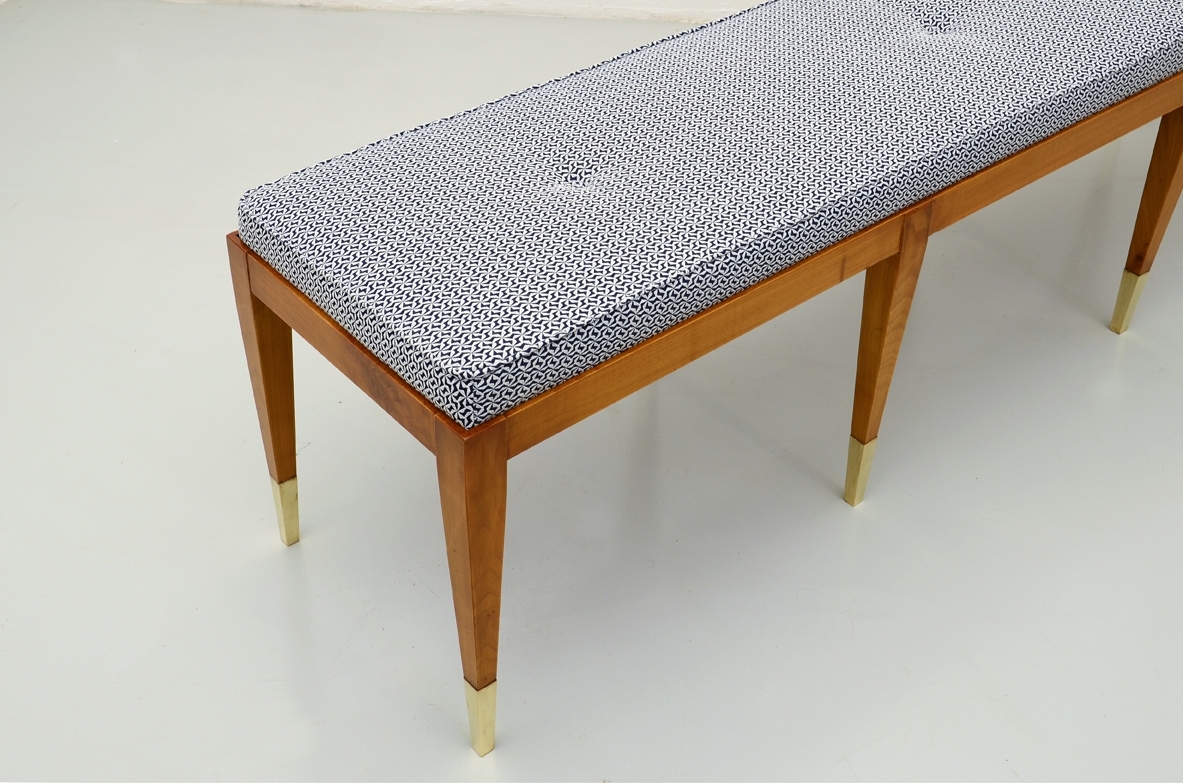 Elegant bench in cherry wood with nice and thin brass tips. Manufactured by Officina Antiquaria