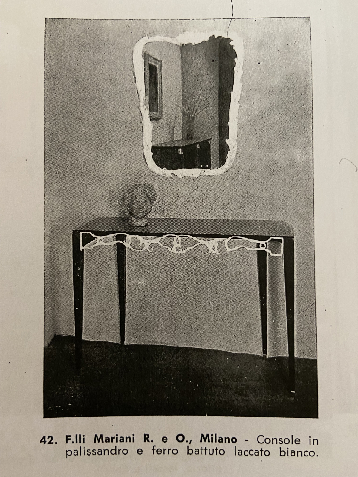 Fabrizio Clerici  Console in palissandro con fronte in ferro battuto, piano in cristallo e puntali in ottone.  Manifattura Flli Mariani, Milano, 1950ca.