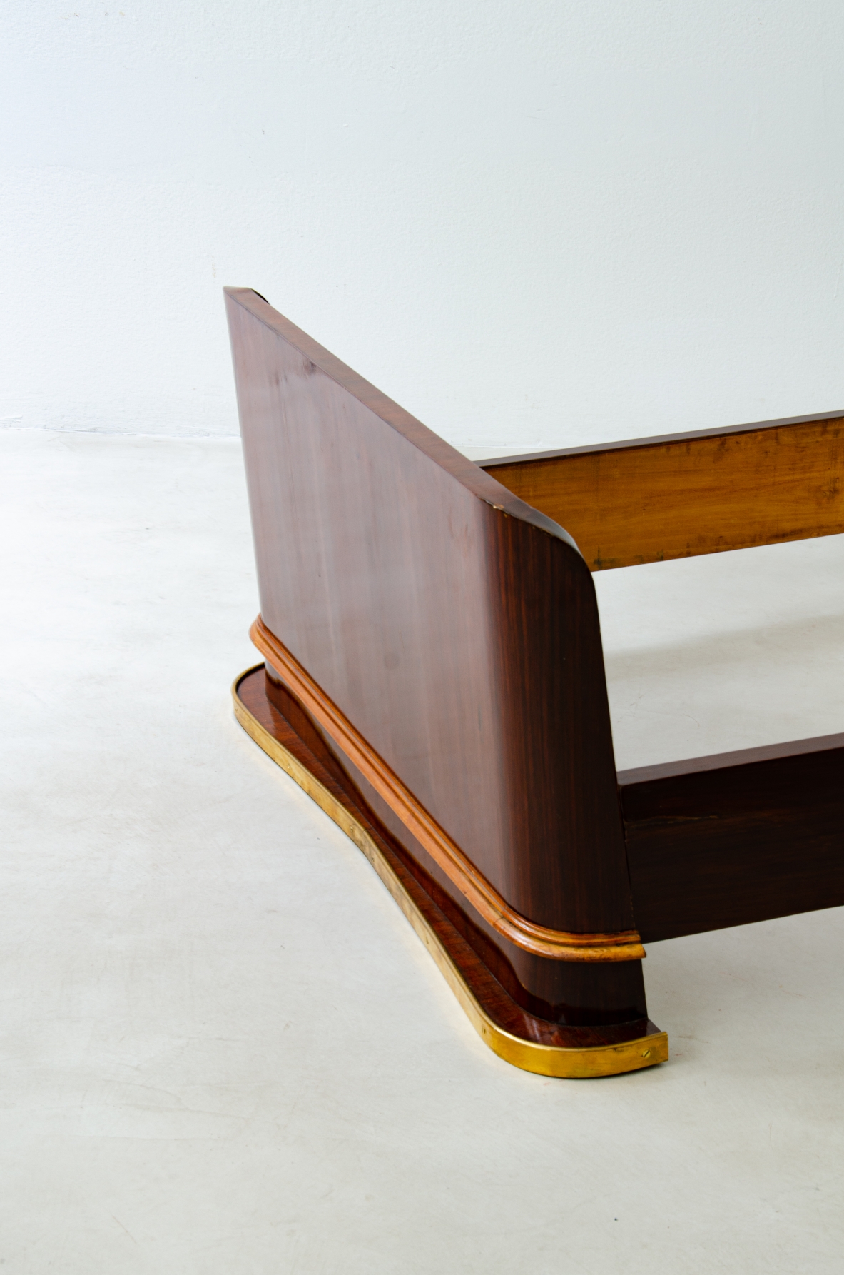 Pair of elegant rosewood beds with blond maple profiles and parchment headboard, brass details.  Italian manufacture, 1940's.