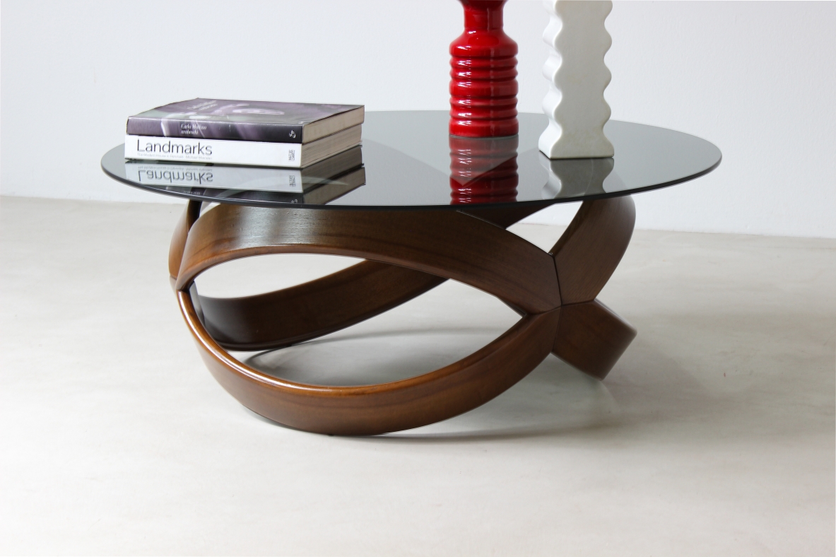 Low table with curved wooden base. Italian manufacture, 1970's.