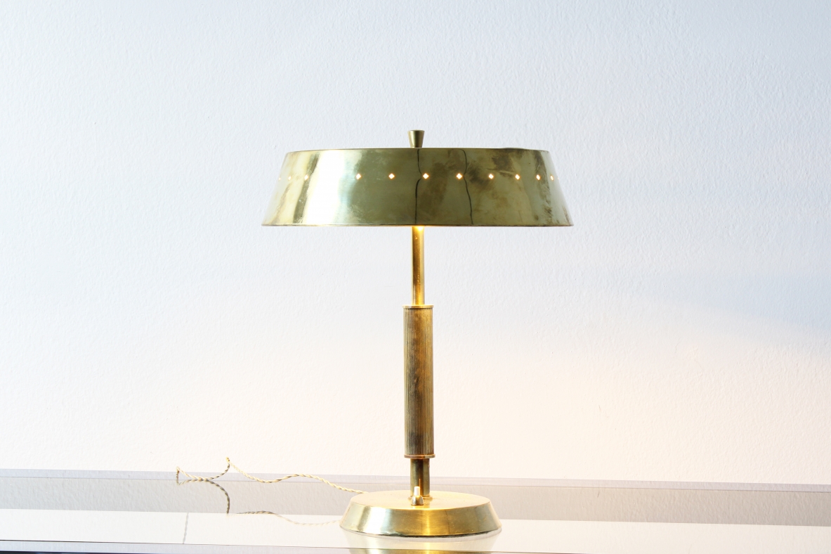 Table lamp in brass with motif of perforated stars on the hat. Italian manufacture, 1940's