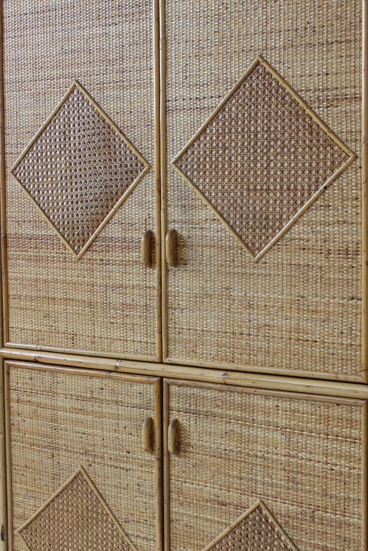 Wardrobe in ash wood, covering in raffia and rattan. Vivai del Sud, 1960's.