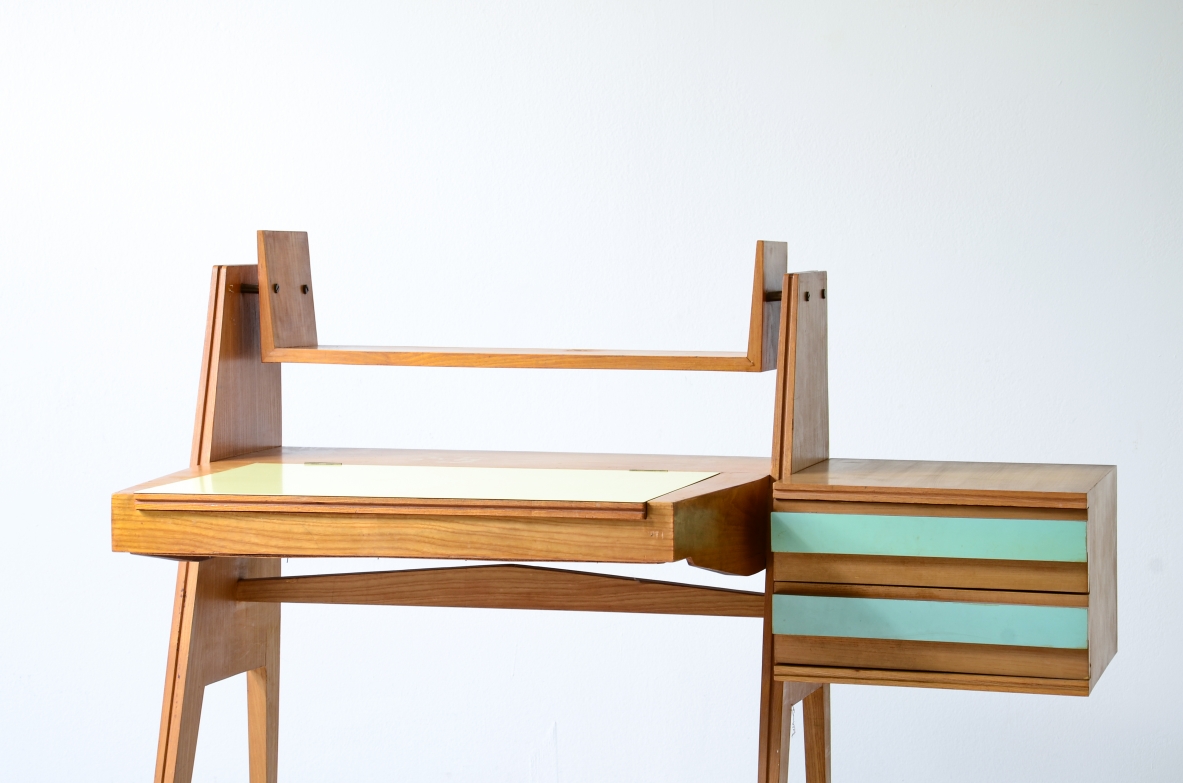 Ico Parisi (1916-1996)  Bedroom writing desk in oak with compartment for objects and shelf. Two drawers on the right side. Top and drawers with original period polypropyleneapplications.  Italian manufacture, 1955. ( to be restored)
