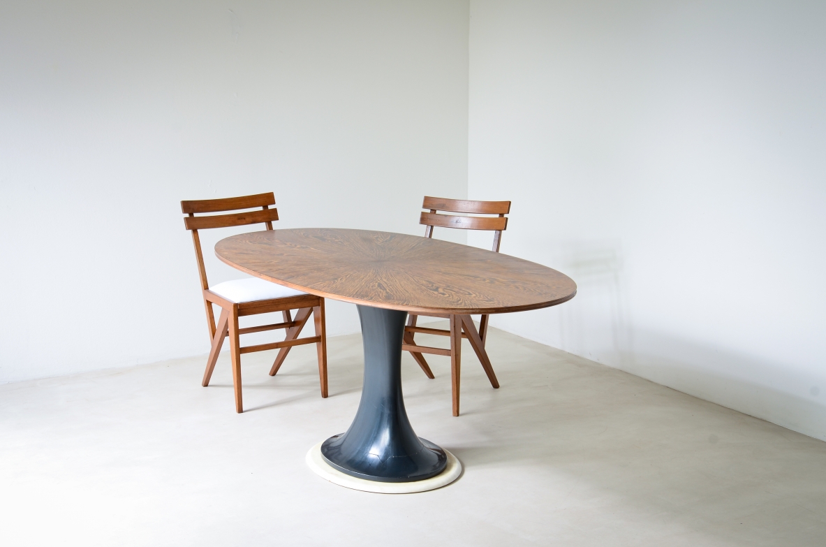 Elegant oval table with turned base in petrol blue lacquered wood and marble disc.  Palm wood veneer top.  Turin School, 1960's.