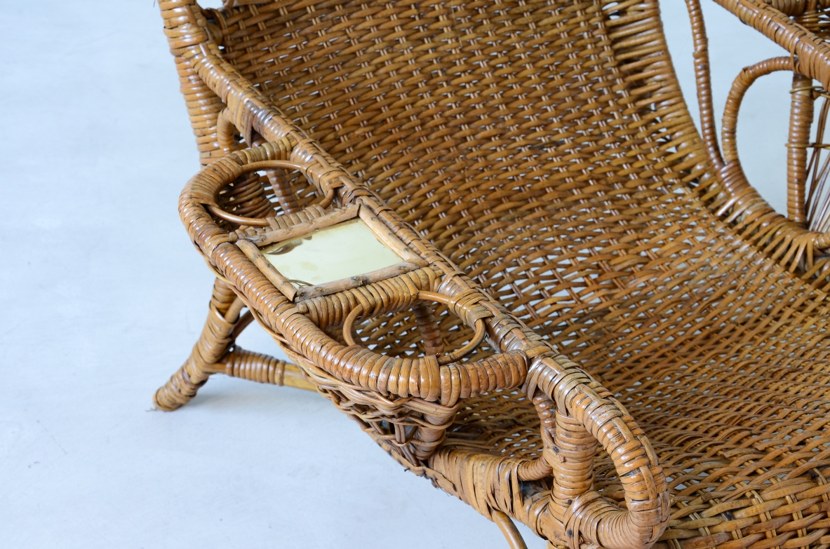 Pair of elegant willow armchairs with weaving on the seat and back as well as composed details, shapes and decorations. Italian manufacture 1950ca.
