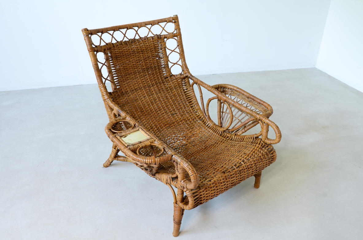 Pair of elegant willow armchairs with weaving on the seat and back as well as composed details, shapes and decorations. Italian manufacture 1950ca.