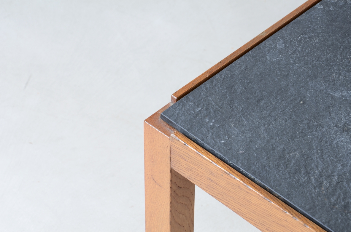 Low table with wooden and slate top, one compartment under the central wooden top and two side shelves.  Italian manufacture around 1960s.