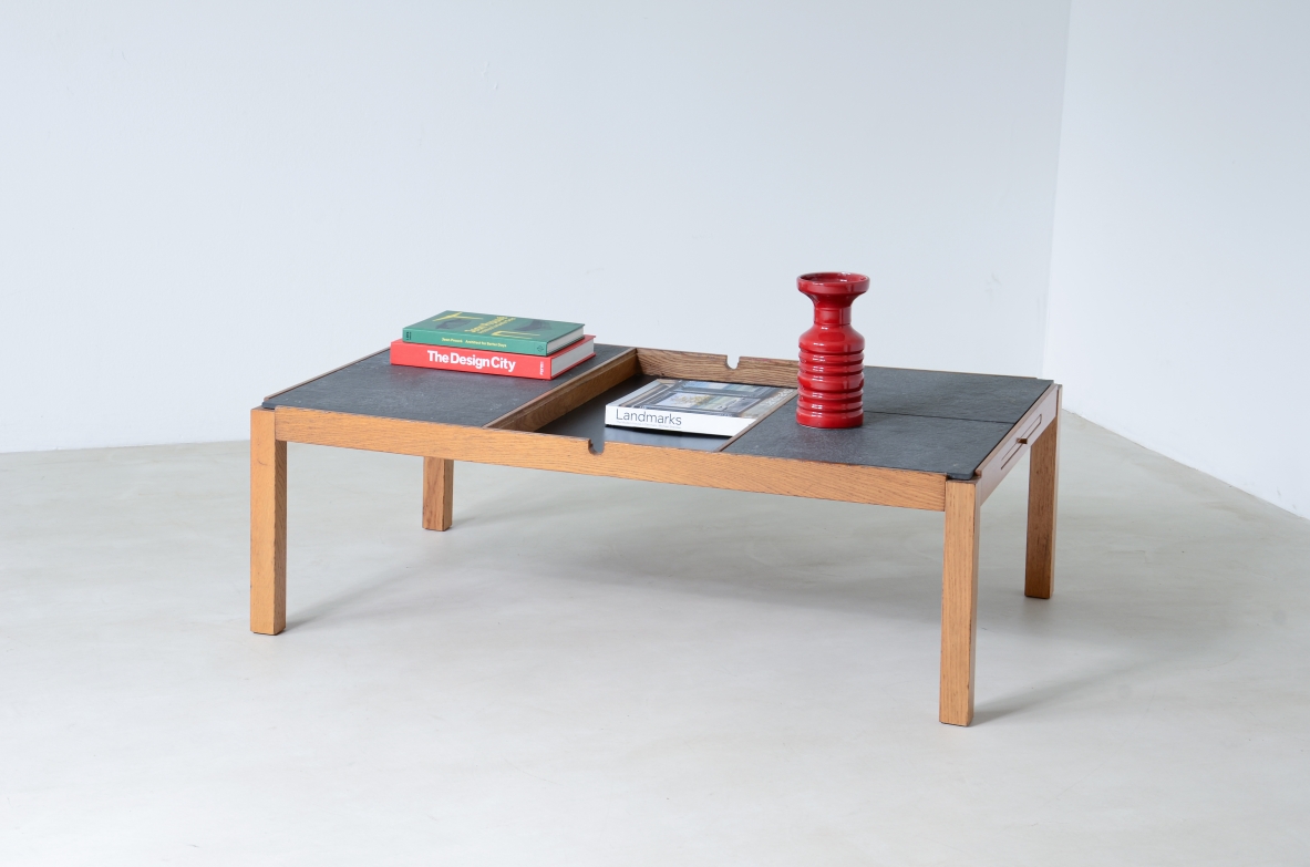 Low table with wooden and slate top, one compartment under the central wooden top and two side shelves.  Italian manufacture around 1960s.