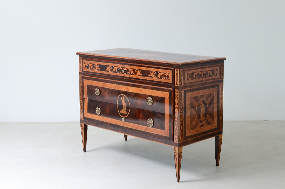 Furniture inlaid with precious woods. Three drawers with brass handles and vents.  Italian manufacture, Lombardy, Louis XVI era, around 1780