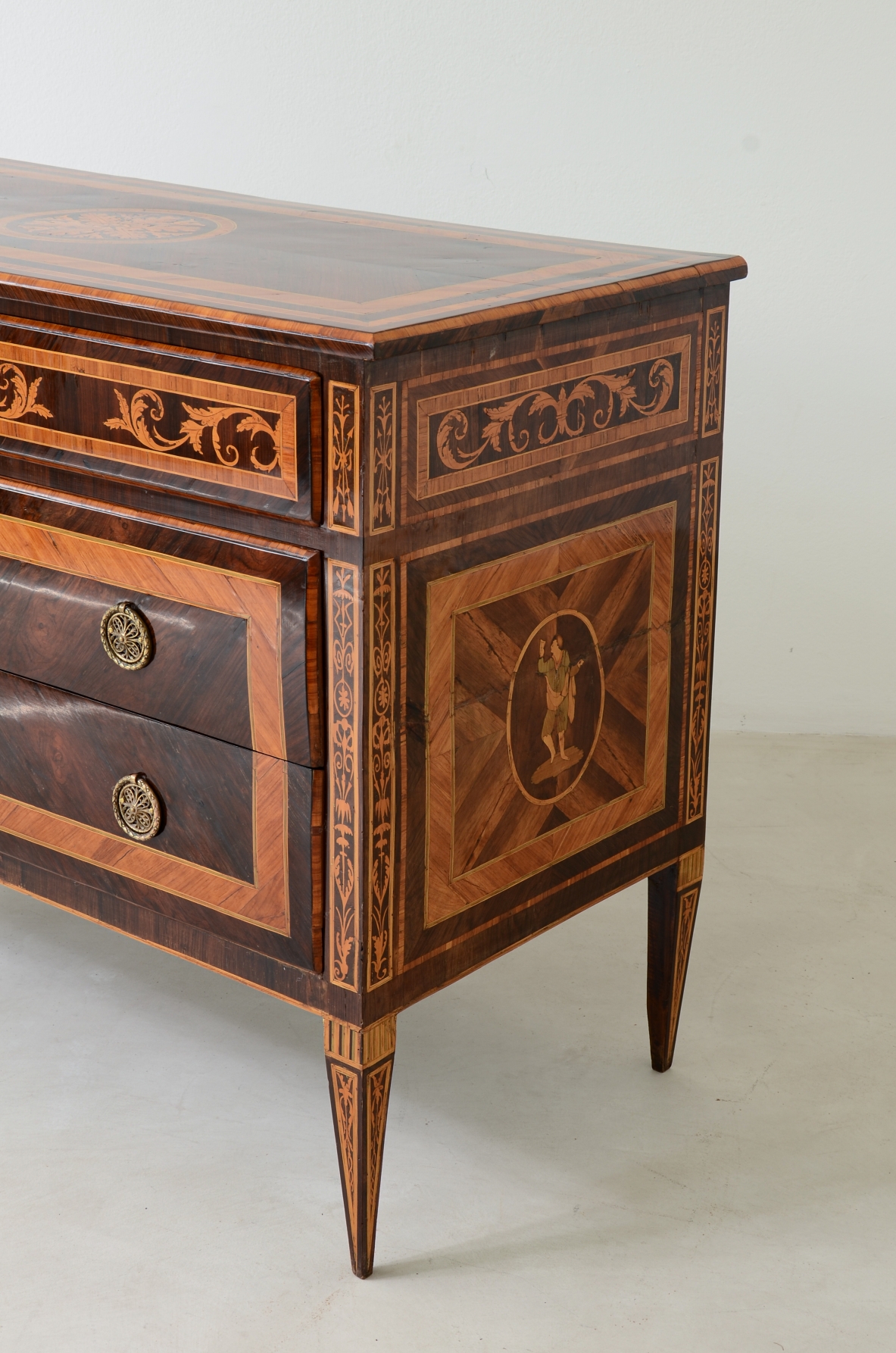 Furniture inlaid with precious woods. Three drawers with brass handles and vents.  Italian manufacture, Lombardy, Louis XVI era, around 1780