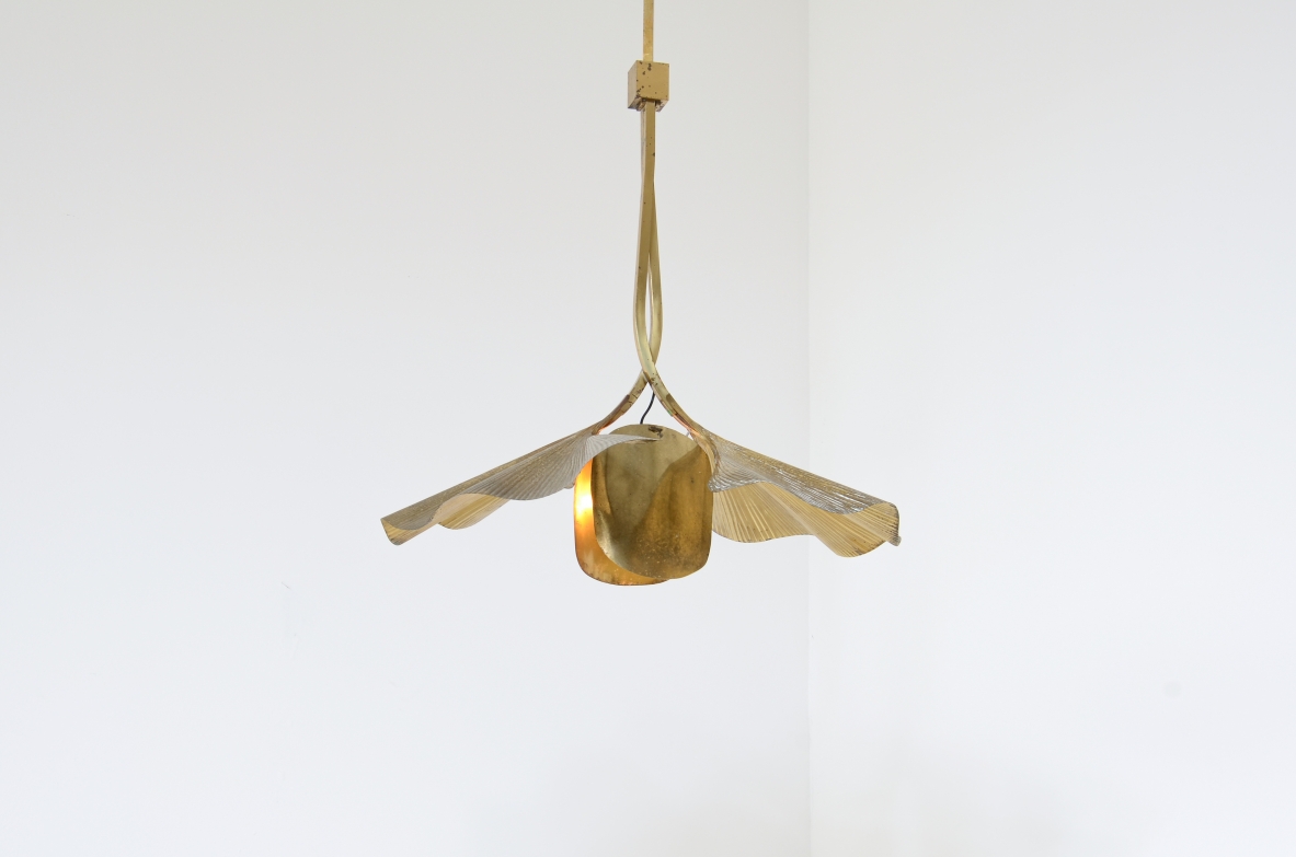 Tommaso Barbi  Large pendant chandelier made by the renowned artist and designer in the shape of a flower composed of 2 large brass ginko leaves and intertwined branches.  Italian manufacture from the 70's