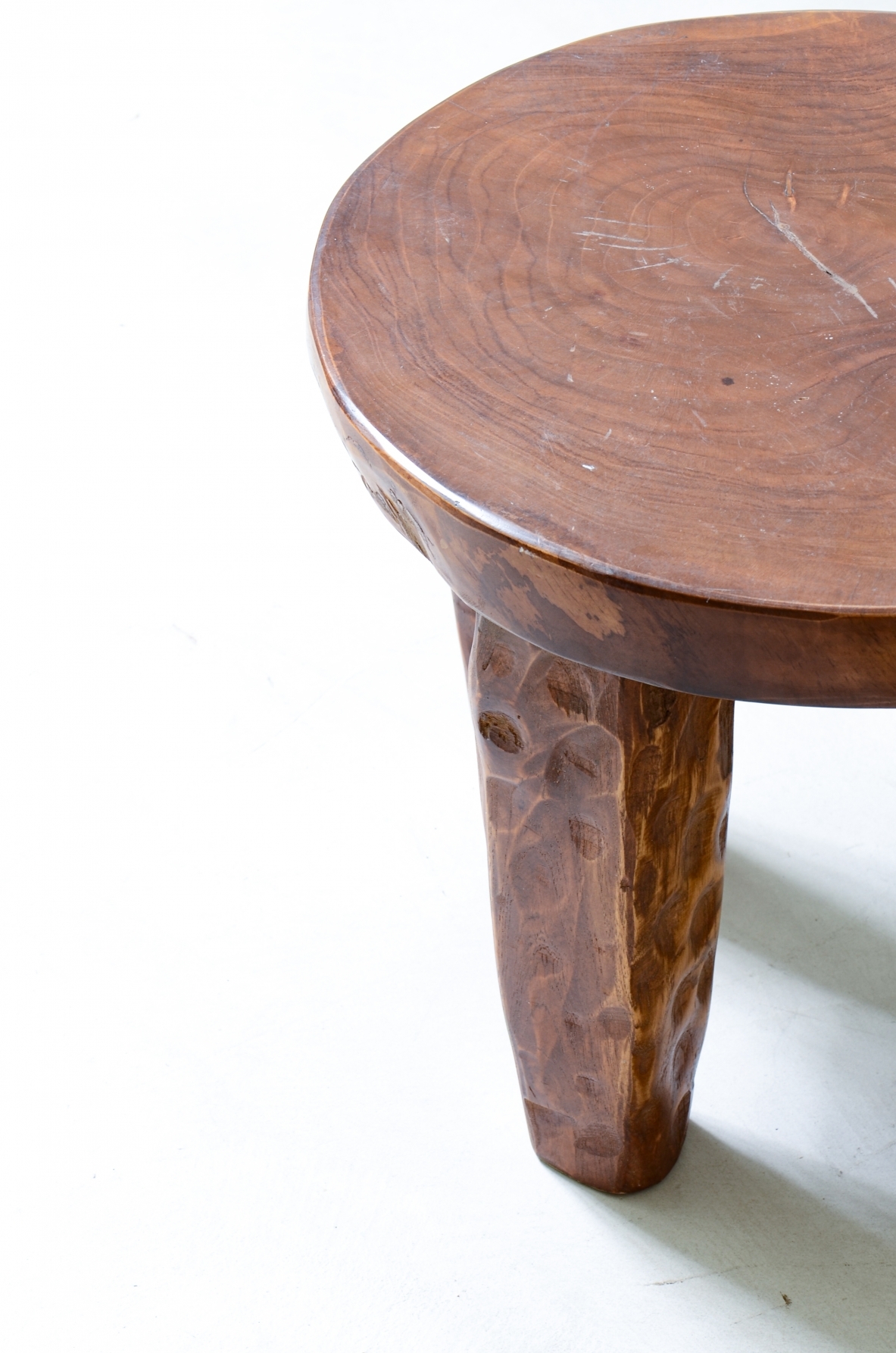 Pair of walnut stools with gouged wooden feet.  Italian manufacture from the 1930s